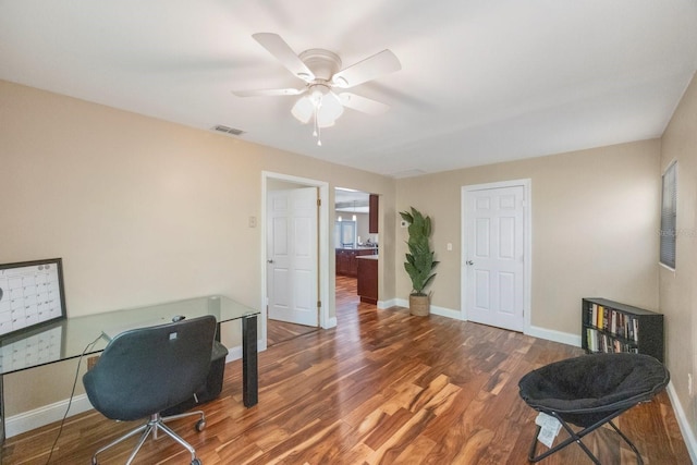 office featuring dark hardwood / wood-style flooring and ceiling fan