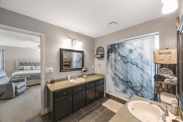 bathroom featuring tile patterned floors, ceiling fan, and vanity