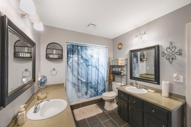 bathroom featuring vanity, toilet, curtained shower, and tile patterned flooring