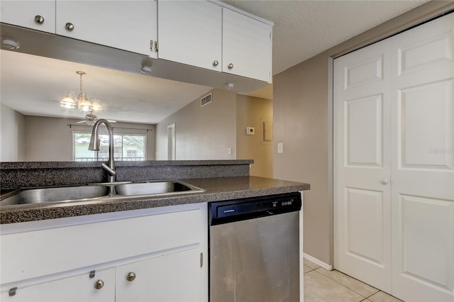 kitchen featuring dishwasher, white cabinetry, a notable chandelier, sink, and light tile patterned flooring