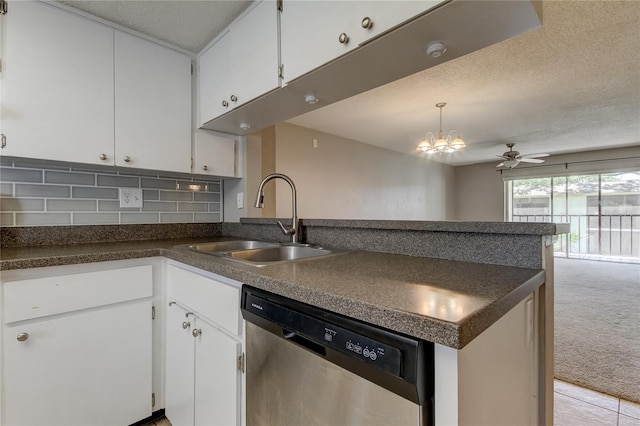 kitchen featuring ceiling fan with notable chandelier, white cabinetry, dishwasher, sink, and light colored carpet