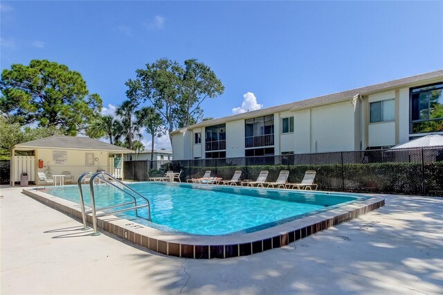 view of swimming pool featuring a patio