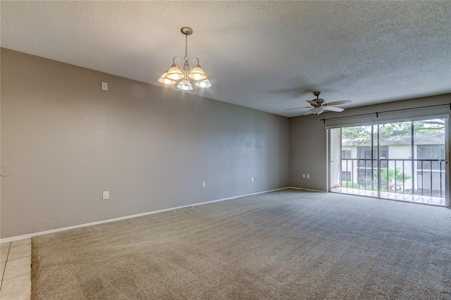 carpeted empty room with ceiling fan with notable chandelier and a textured ceiling