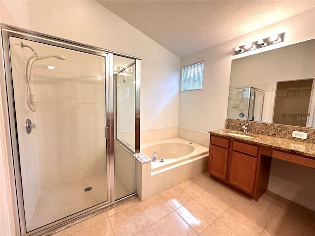 bathroom with lofted ceiling, shower with separate bathtub, a textured ceiling, vanity, and tile patterned flooring