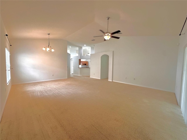 unfurnished living room with light carpet, lofted ceiling, and ceiling fan with notable chandelier