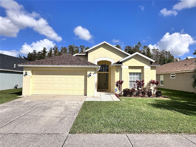 single story home featuring a front yard, roof with shingles, an attached garage, stucco siding, and concrete driveway