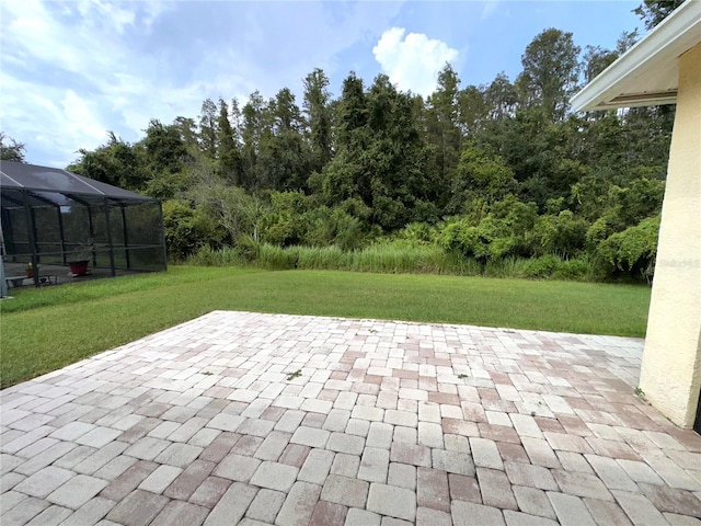 view of patio / terrace featuring glass enclosure