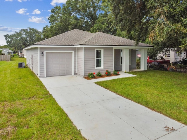 ranch-style home with a front lawn, a garage, and central AC