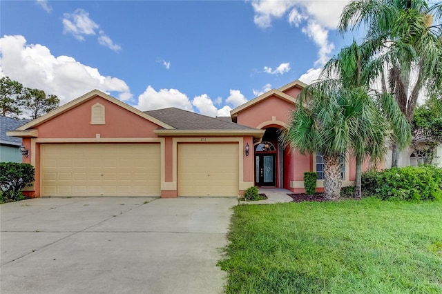 single story home featuring a front yard and a garage