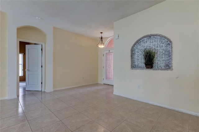 empty room with light tile patterned floors