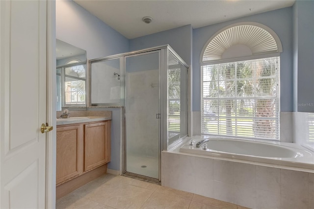 bathroom with vanity, plus walk in shower, and plenty of natural light