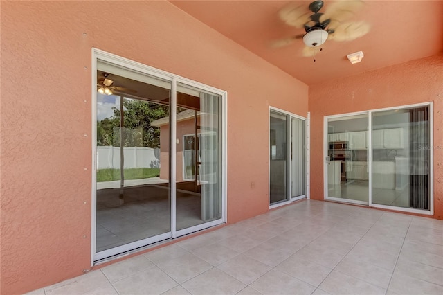 view of patio featuring ceiling fan