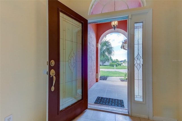 foyer entrance with light tile patterned floors