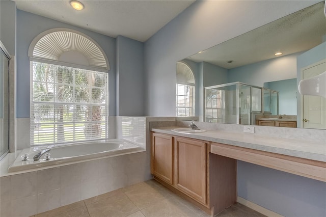 bathroom featuring tile patterned floors, independent shower and bath, and vanity