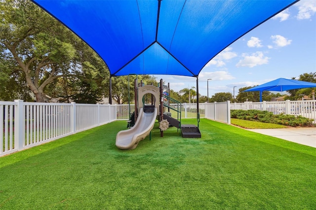 view of jungle gym with a yard