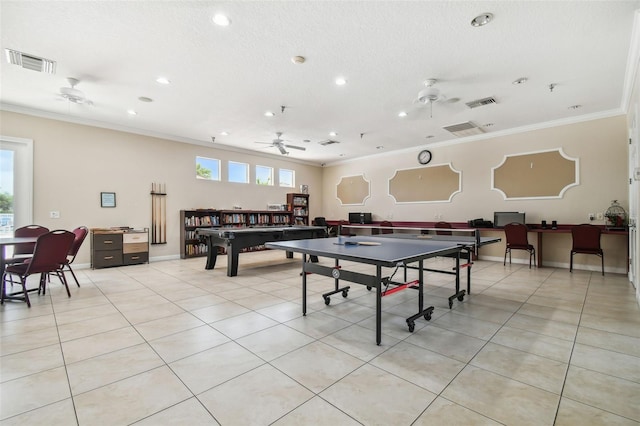 rec room with ceiling fan, crown molding, light tile patterned floors, and a textured ceiling