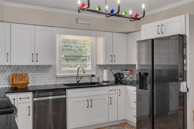 kitchen featuring ornamental molding, appliances with stainless steel finishes, sink, and white cabinets