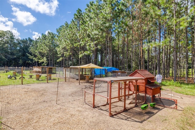 view of jungle gym with an outbuilding