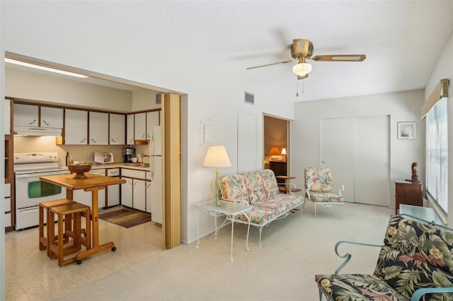 living room featuring ceiling fan