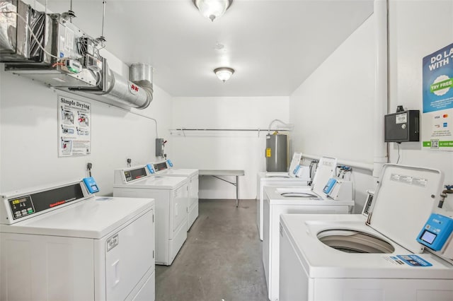 washroom featuring electric water heater and washer and dryer