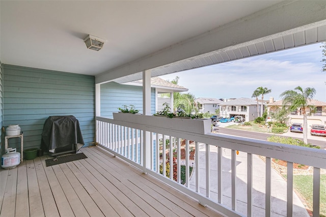 wooden terrace featuring grilling area