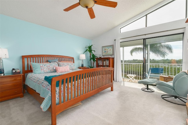 carpeted bedroom featuring lofted ceiling, access to exterior, ceiling fan, and a textured ceiling