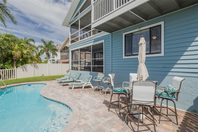 view of swimming pool with a patio