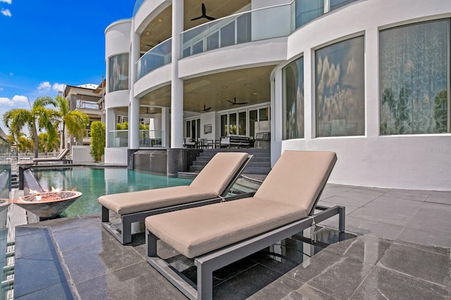 view of patio featuring a balcony