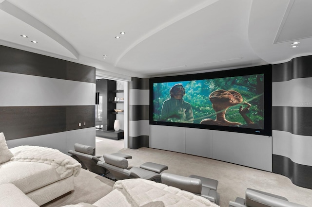 cinema room featuring light colored carpet