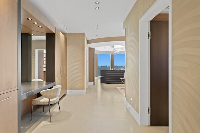 corridor featuring light tile patterned floors