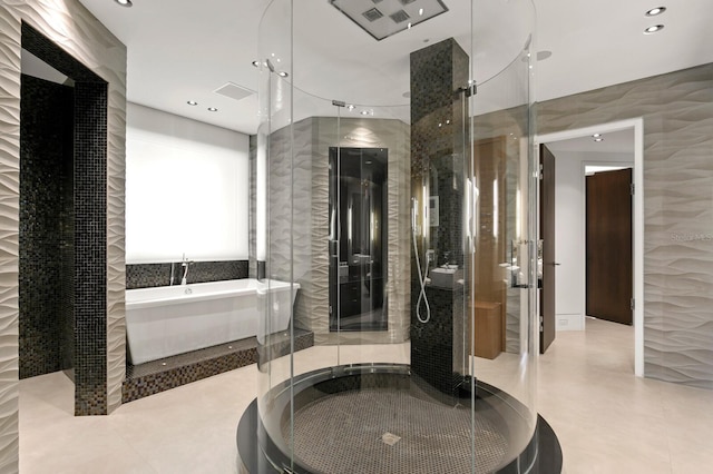 bathroom featuring independent shower and bath, tile walls, and tile patterned floors