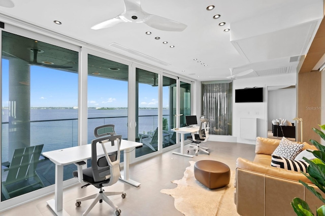 office area featuring ceiling fan and expansive windows