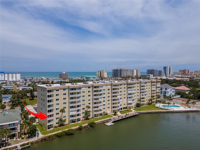 birds eye view of property with a water view