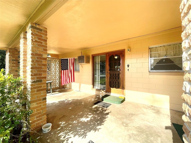 view of patio / terrace with a wall unit AC