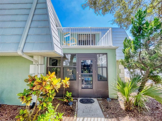 doorway to property with a balcony