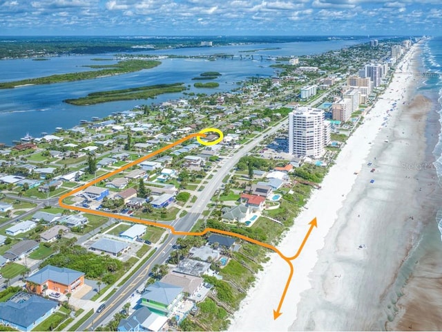 bird's eye view with a view of the beach and a water view