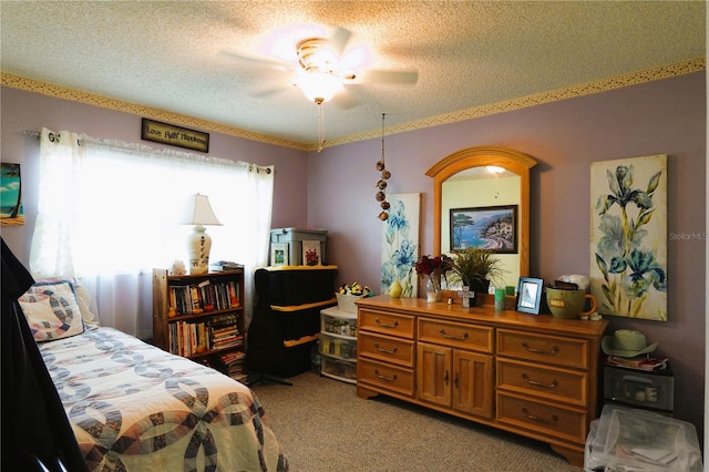 carpeted bedroom with a textured ceiling and ceiling fan