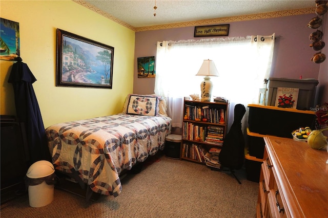 bedroom with carpet flooring and a textured ceiling