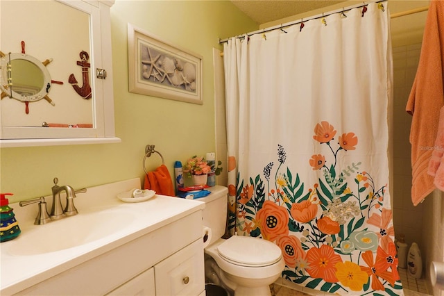 bathroom with oversized vanity, toilet, and tile floors