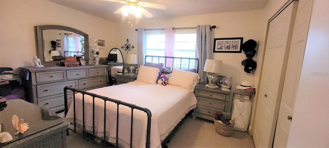 bedroom with dark carpet and ceiling fan