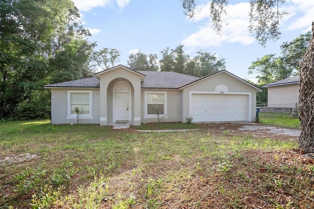 ranch-style home featuring a garage and a front yard