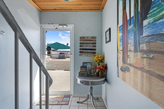 entryway featuring wood ceiling and light tile floors