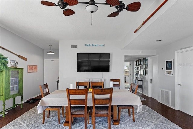 dining room featuring ceiling fan and dark hardwood / wood-style flooring