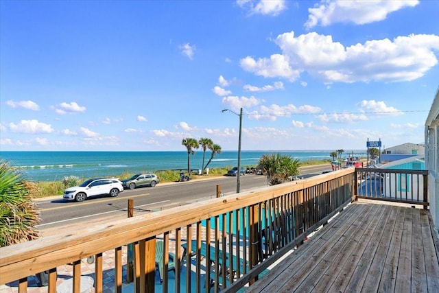 wooden deck featuring a water view