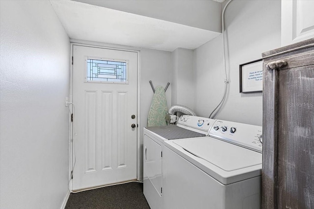 laundry room with dark carpet and separate washer and dryer