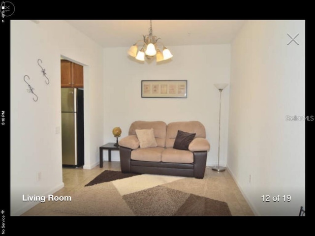 living room with an inviting chandelier