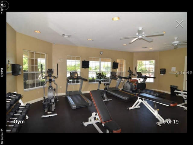 exercise room featuring ceiling fan and a healthy amount of sunlight