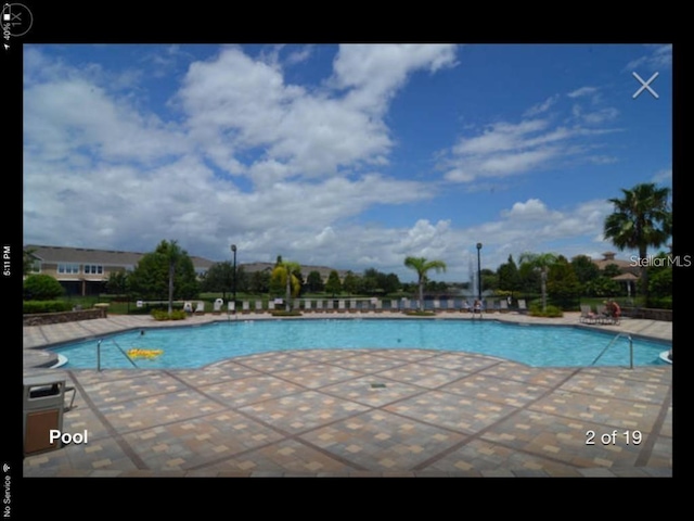 view of swimming pool featuring a patio area