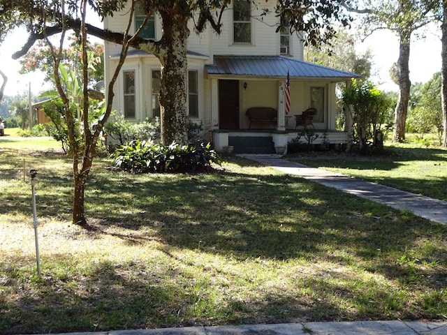 view of front of home with a front lawn and covered porch