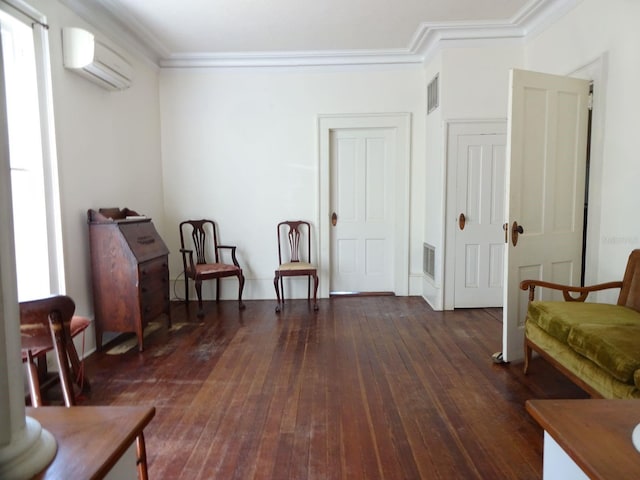 living area with ornamental molding, a wall mounted AC, and dark wood-type flooring